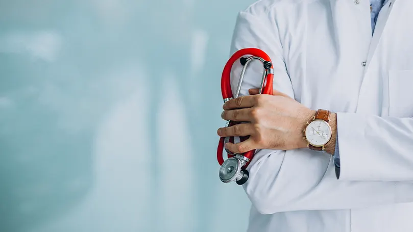 An image of a doctor holding their medical equipment