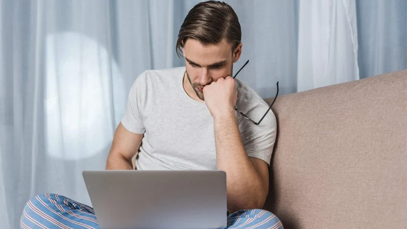 a man working late night in front of laptop