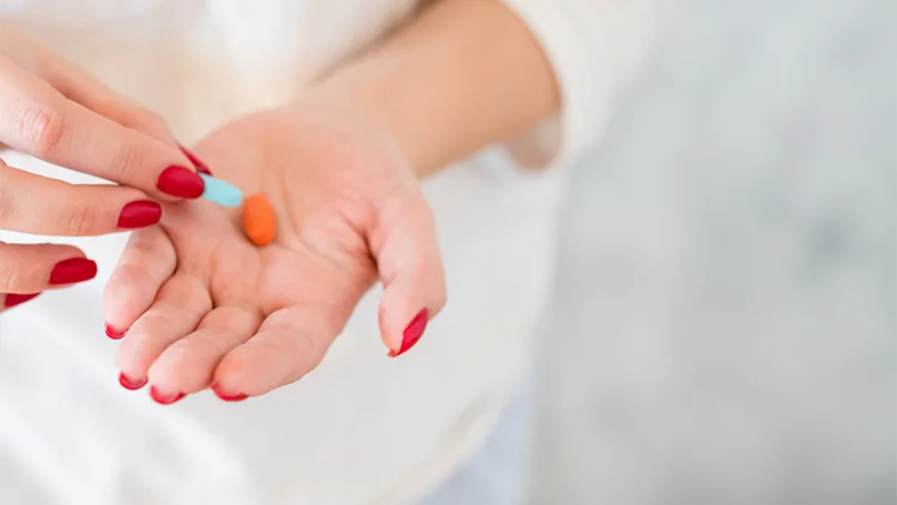 a woman taking a daily dose of magnesium