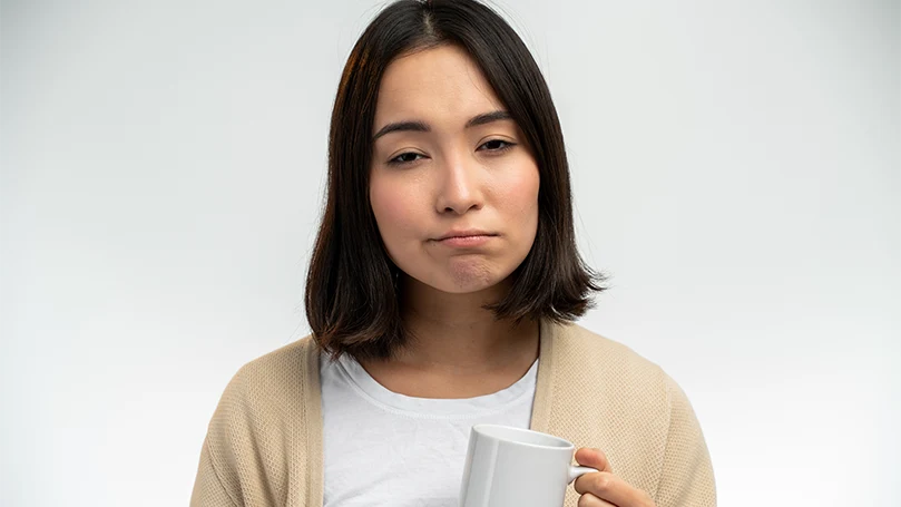 An image of A handsome sleepy Asian woman.