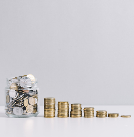 An image of coins stacked on a flat surface